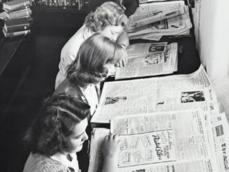 grayscale photo of women reading newspaper